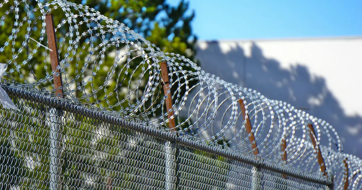 how to run barbed wire fence