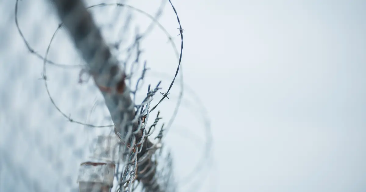 how to run barbed wire fence